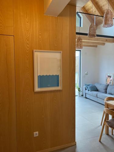 a living room with a painting on the wall at Nova Drina in Ljubovija