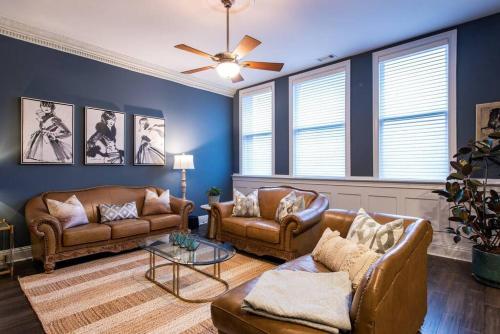 a living room with two couches and a ceiling fan at Downtown Sophistication/ Two Bedroom / Two Bath in Louisville