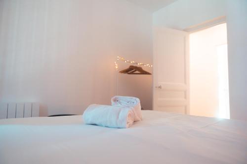 מיטה או מיטות בחדר ב-Le Gamay Appartement 6 personnes