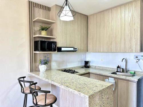 Kuhinja oz. manjša kuhinja v nastanitvi Moderno e Iluminado Apartamento