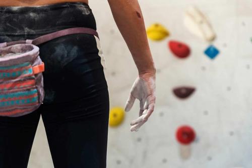 a woman with her hand in a rock wall at Loch Rannoch Hotel and Spa in Kinloch Rannoch