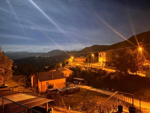 a view of a village at night with lights at Affittacamere La Dimora dei Nonni in Cascia