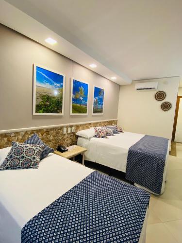 Postel nebo postele na pokoji v ubytování Hotel Aldeia da Praia