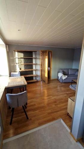 a living room with a desk and a couch at Sofi Apartment in Võru