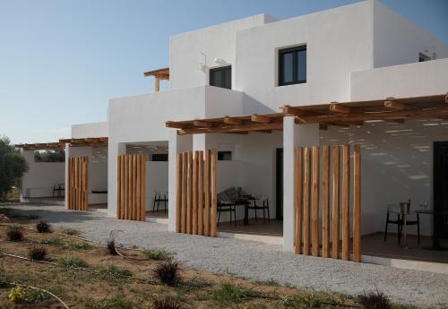 a house with wooden dividers in front of it at Iphimedeia Luxury Hotel & Suites in Naxos Chora