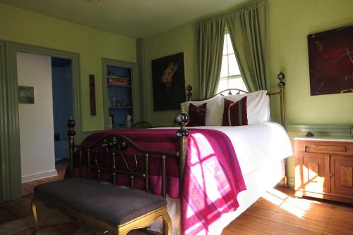 a bedroom with a bed and a window at Eileen of Mystic in Mystic
