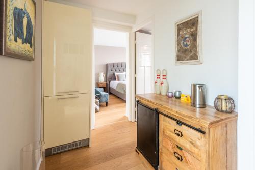 a kitchen with a wooden counter and a refrigerator at Big Room in Amsterdam