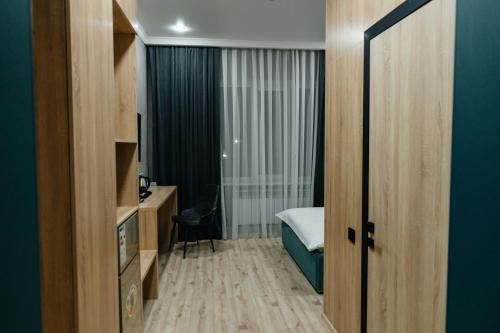 Ein Bett oder Betten in einem Zimmer der Unterkunft Sunrise Hotel