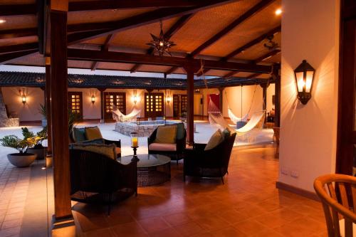 a living room with chairs and a table in a building at JW Marriott Guanacaste Resort & Spa in Tamarindo