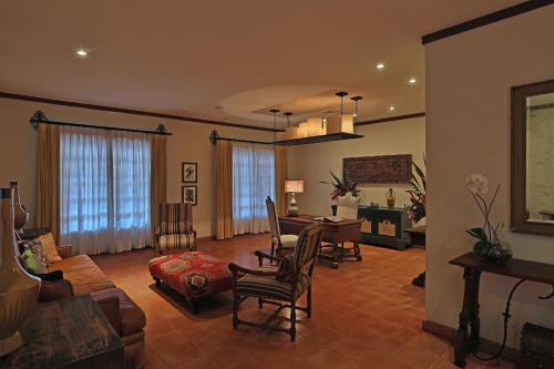a living room with a couch and a table and chairs at JW Marriott Guanacaste Resort & Spa in Tamarindo
