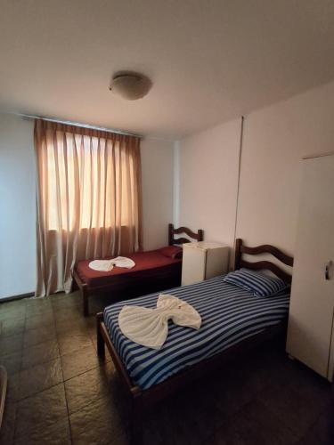 Katil atau katil-katil dalam bilik di Hotel Nuar