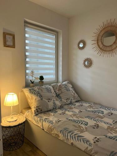 Ένα ή περισσότερα κρεβάτια σε δωμάτιο στο Apartament Chiara