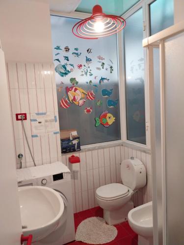 a bathroom with a toilet and a sink at Casa Patrizia in Monterosso al Mare