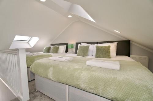 a bedroom with two beds in a attic at Dane Duplex Studio Seven - Your Dream Coventry Stay in Coventry