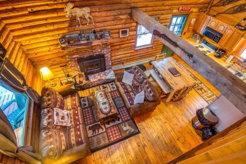 an overhead view of a living room in a log cabin at Family-Focused & Pet-Friendly Log Cabin with 4BR 2BA Sleeps 10 in Bethlehem
