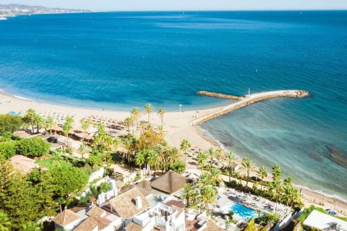an aerial view of a beach with a pier at Luxury Duplex Penthouse Sea Views in Marbella Golden Mile in Marbella