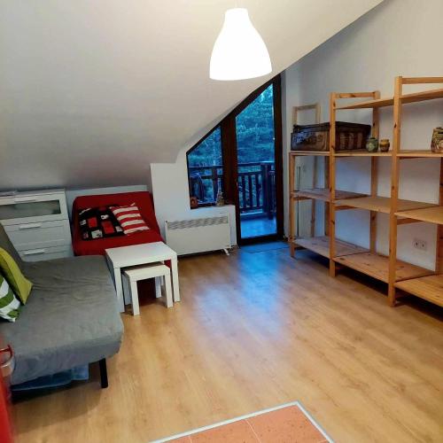 a living room with a couch and a table at Art Studio Borovets Semiramida in Borovets