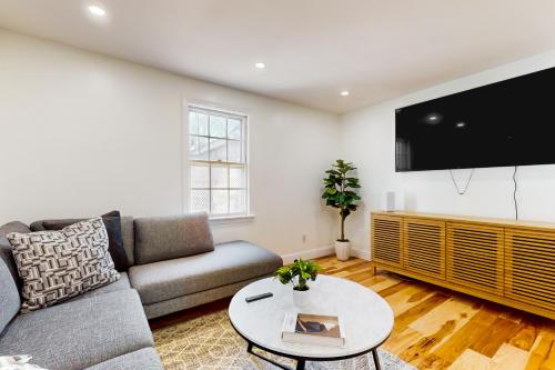 a living room with a couch and a table at In-between the Coast and the City in Everett