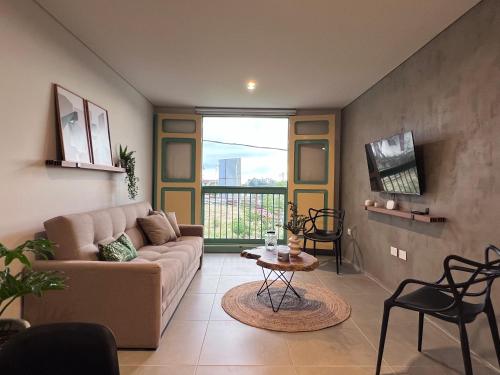 a living room with a couch and a table at Parallelo Loft Salento P4 in Salento