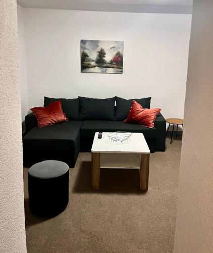 a living room with a couch and a coffee table at Apart Cobras Jajce in Jajce