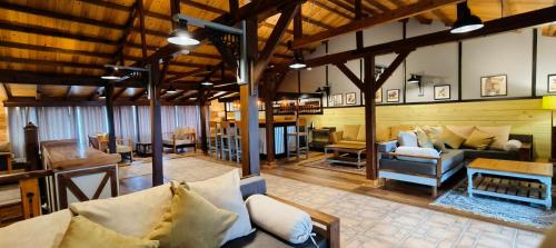 a living room with couches and tables in a building at Manila Hideaway in Sater
