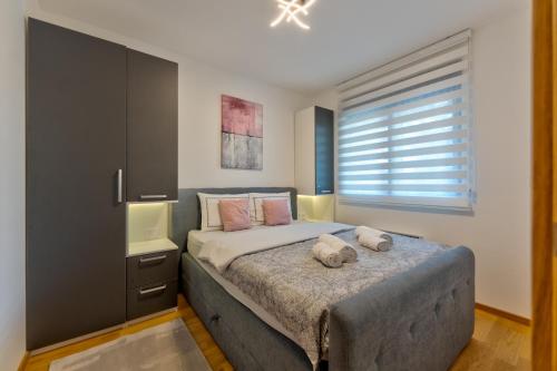 Postel nebo postele na pokoji v ubytování VM apartmani