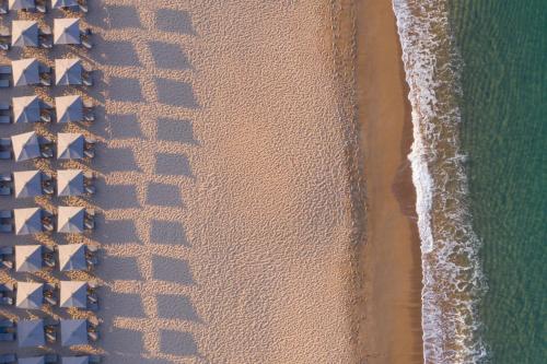 an overhead view of the beach and the ocean at The Romanos, a Luxury Collection Resort, Costa Navarino in Romanós