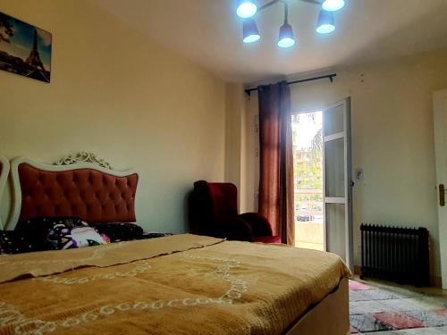 Postel nebo postele na pokoji v ubytování Family 2bhk - AIR MALL - BGhomes