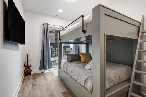 a bedroom with a bunk bed with a mirror at Jolene Dream - East Nashville - 1,2mi to Broadway in Nashville