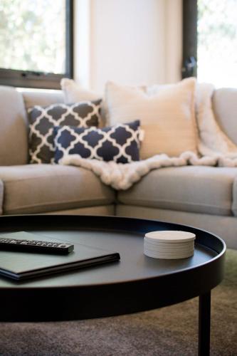 a living room with a couch and a coffee table at Homely Unit Located Near the City with Parking and Wifi in Kings Meadows