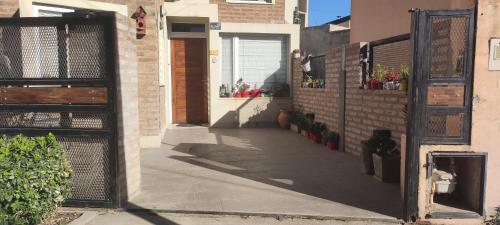 an entrance to a building with an open gate at Andrés Arro in Viedma