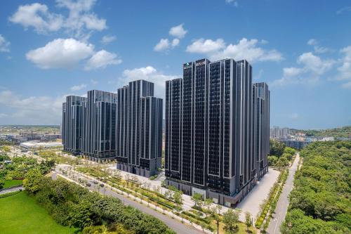 an aerial view of tall buildings in a city at Adoor Suites Shenzhen in Shenzhen