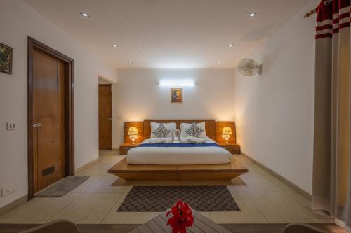 a bedroom with a bed in a room at The Trident I Kasauli by Humble stay villa in Kasauli