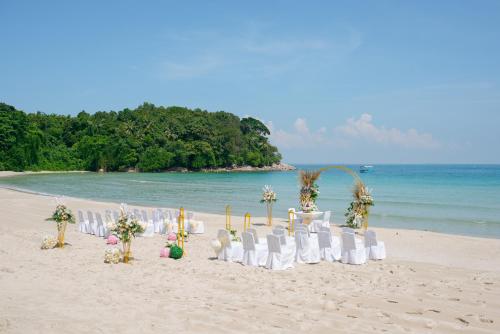 a wedding set up on the beach at Banyu Biru Villa in Lagoi