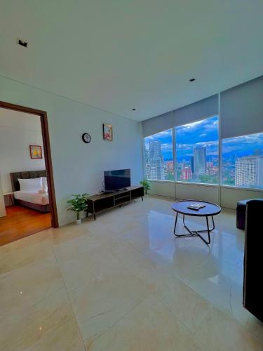 a living room with a view of a city at vortex klcc RR in Kuala Lumpur