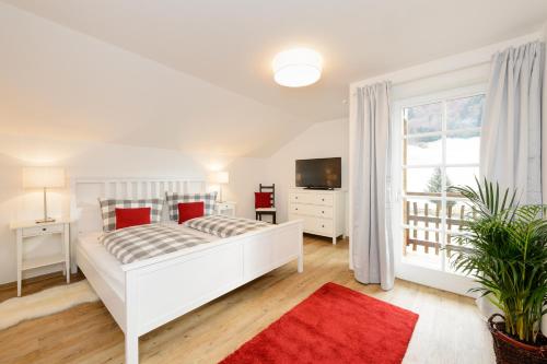 Postel nebo postele na pokoji v ubytování "Viktoria Apartments" - Annehmlichkeiten von 4-Sterne Familien-und Wellnesshotel Viktoria können mitgenutzt werden