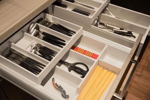 a drawer in a kitchen with tools in it at Villa JacoO-ヴィラじゃこまる- in Sanuki