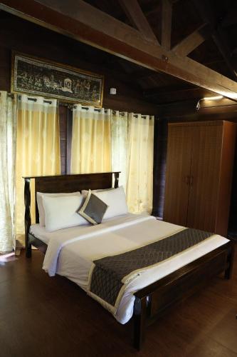 Three Hills Resort Coorgにあるベッド