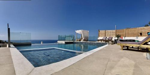 a swimming pool on top of a building at Zax sea view villas in Ierápetra