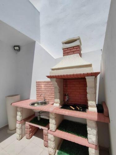 a model of a kitchen with a sink in a room at Ghar el melh in Ghār al Milḩ