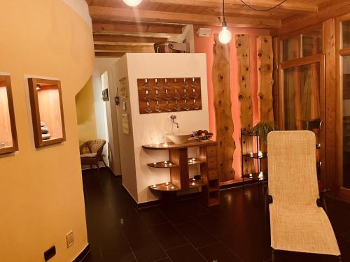a room with a table and chairs in a room at Residence Zirmer Wohnung Sonne in Kastelruth