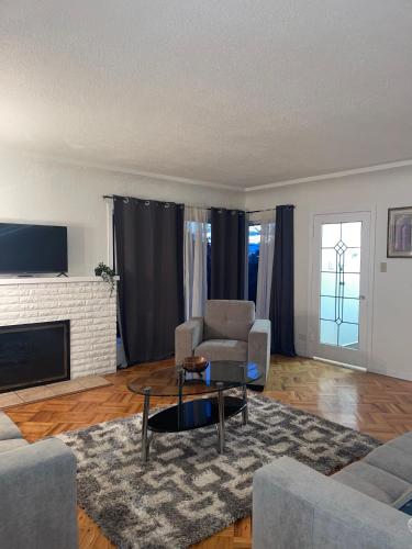 a living room with a couch and a chair at Home in West Vancouver in West Vancouver