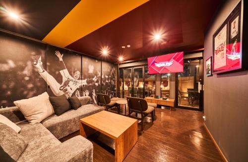 a living room with a couch and a table at Rakuten STAY x EAGLES in Sendai