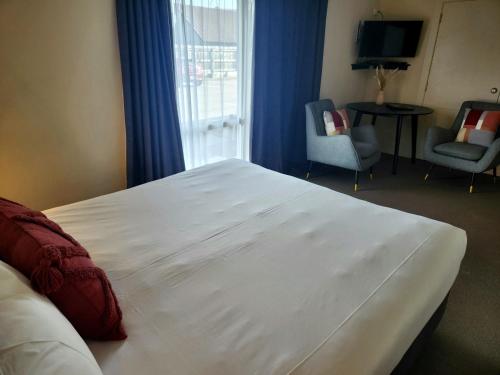 Postel nebo postele na pokoji v ubytování B-Ks Premier Motel Palmerston North