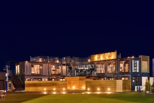 a large building with lights at night at Rakuten STAY x EAGLES in Sendai