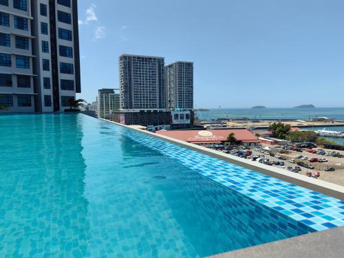 a large swimming pool on the roof of a building at Jesselton Quay by Miraton Lodge 2 in Kota Kinabalu