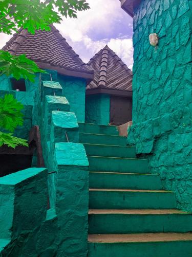 a set of stairs in front of a house at Châteaux Yolande in Mahajanga