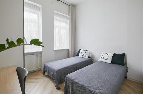 Postel nebo postele na pokoji v ubytování Kurpiai Old Town, 3BD