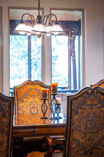 a dining room with a table and two chairs at Volcano Inn Bed n Breakfast in Volcano