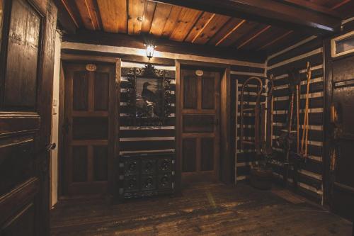 a wine cellar with wood paneling and wine racks at Chalupa Hejmovka in Špindlerův Mlýn
